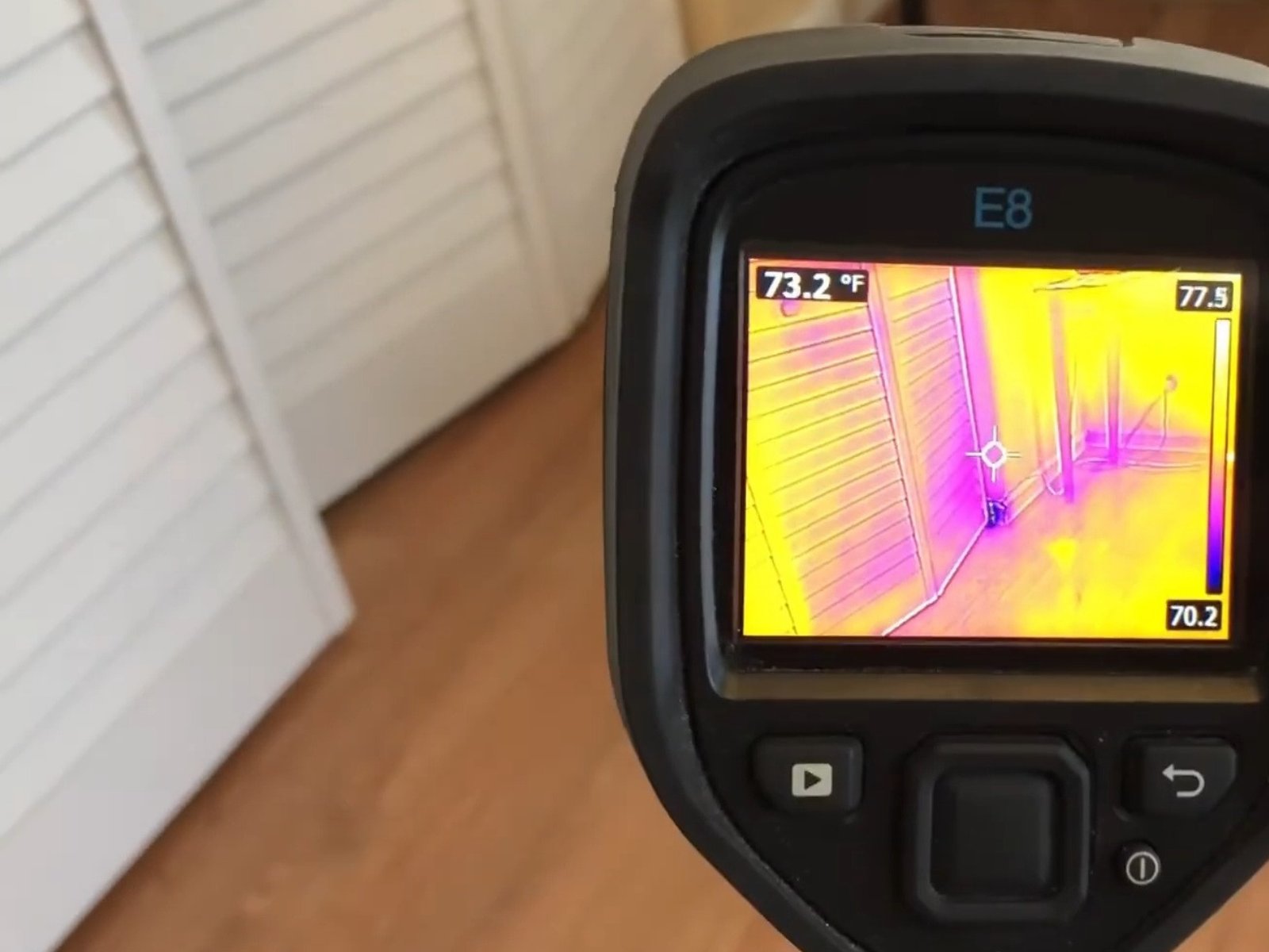 Plumber detecting a slab leak using acoustic equipment